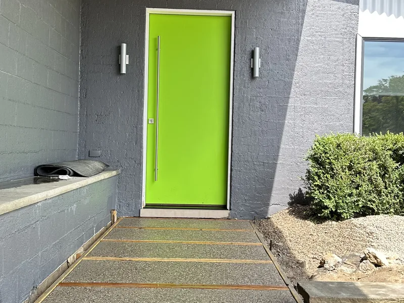 Entry landing and sidewalk by A&M Works