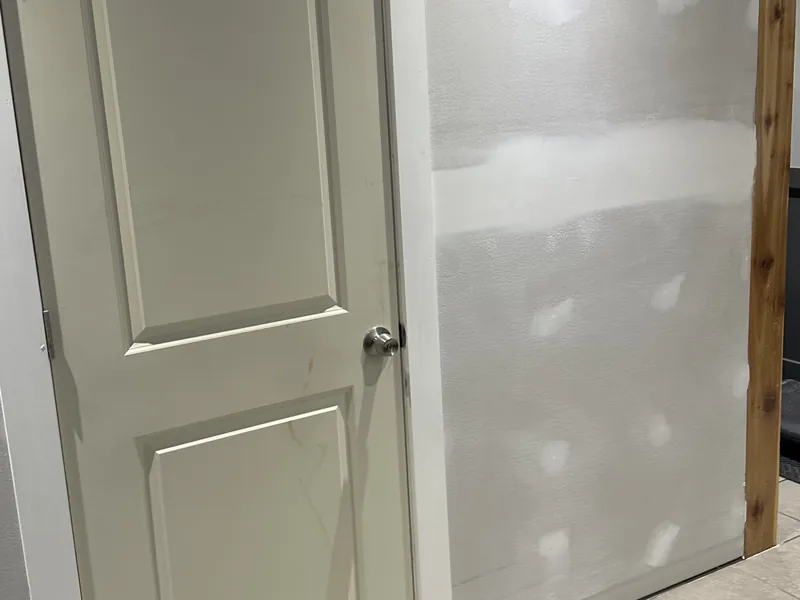 Finished wall around interior door by A&M Works