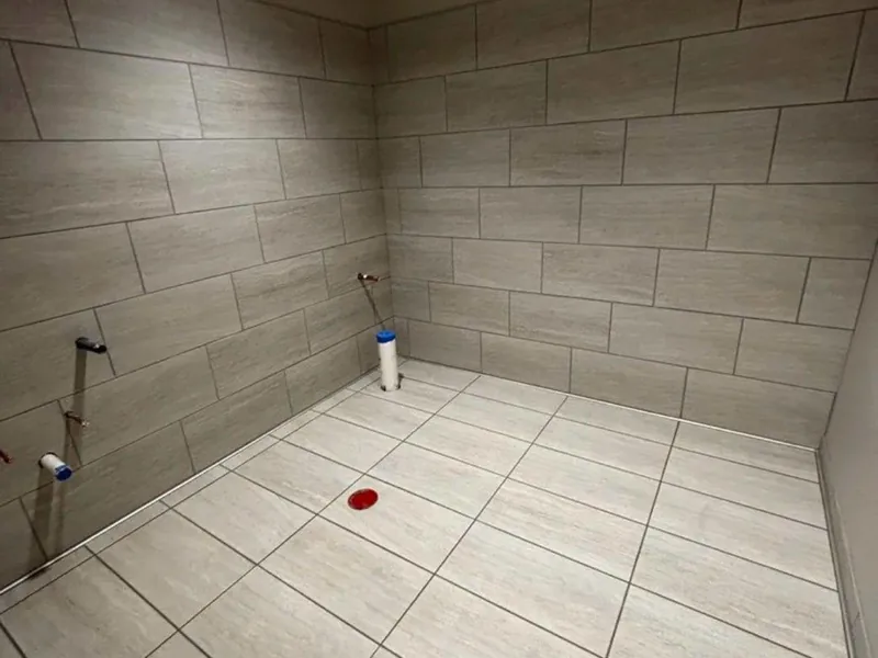 Bathroom wall and floor tile by A&M Works